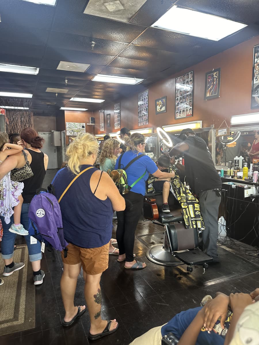 Families lined up for free back-to-school haircuts at Toney's Barbershop in Palm Coast